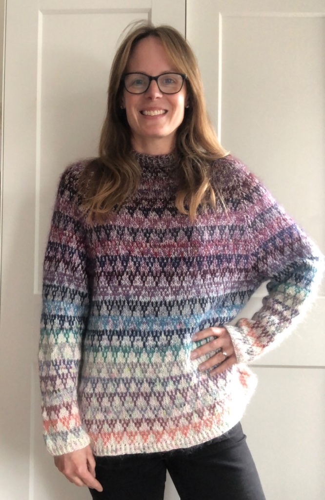 Photo of Dr Mia Hobbs wearing a colour work jumper